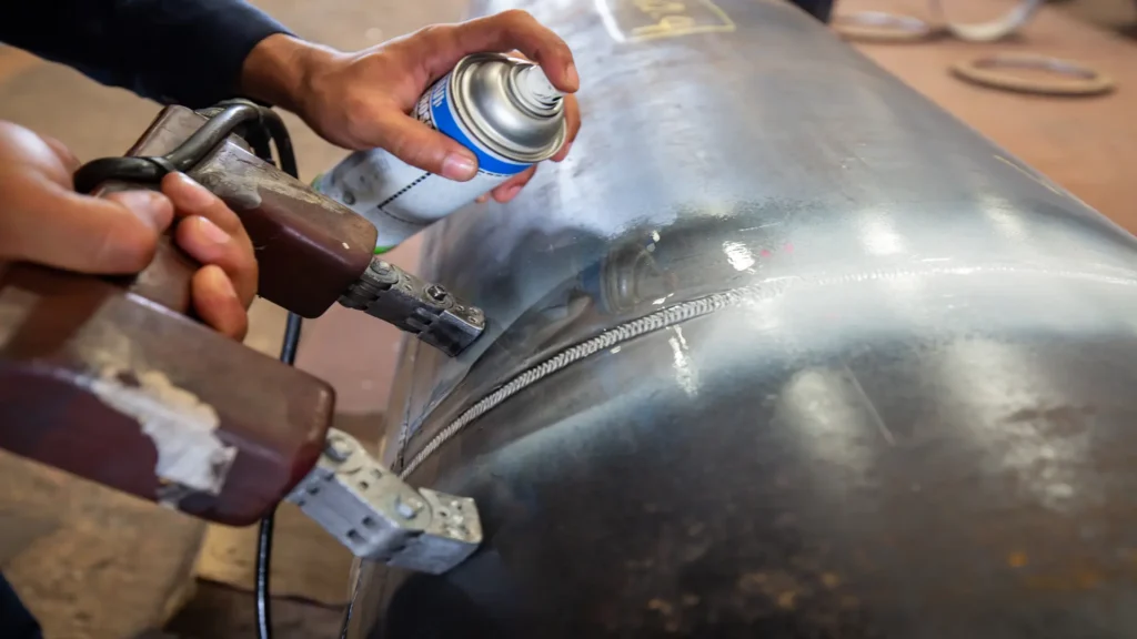 Welding inspection by magnetic particle technique.