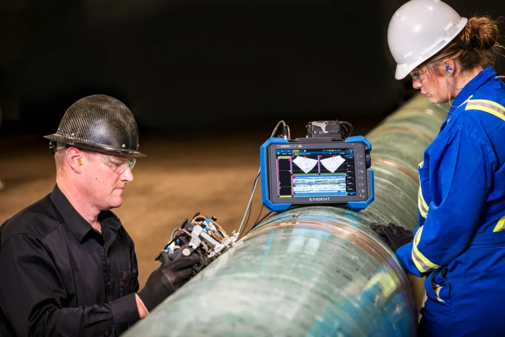 Technicians generating NDT data illustrating the need for an .nde format.