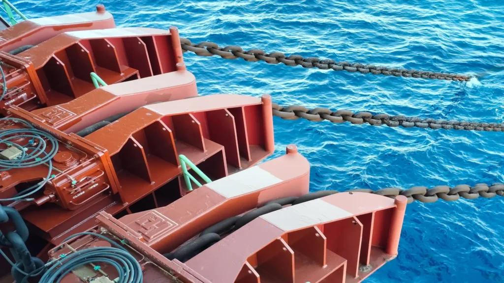 Automated mooring systems with extension chains keep the FPSO in a fixed position.