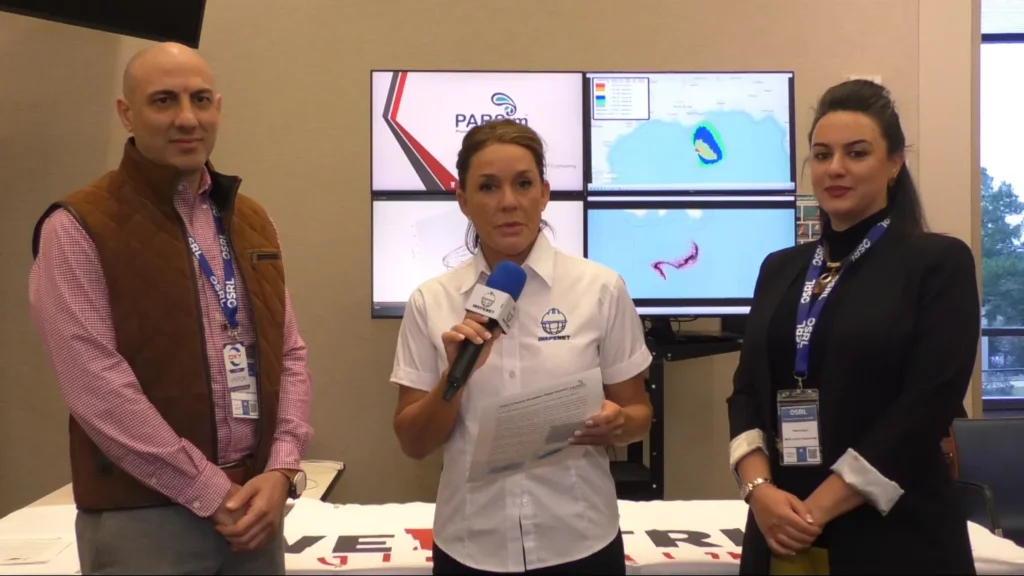 Interview about PARSim at the OSRL 2025 event with representatives from WellCTRL Engineering in front of on-screen simulations.