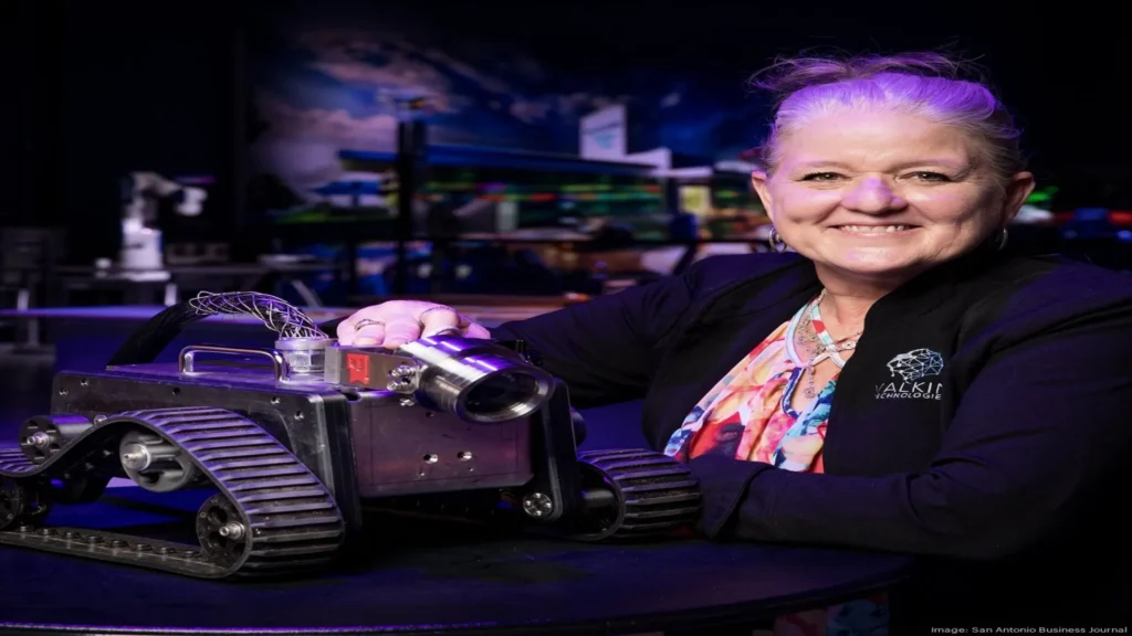 Kimberley Hayes, founder of Valkim Technologies, alongside the robot developed by her company for robotic inspection in hazardous areas.