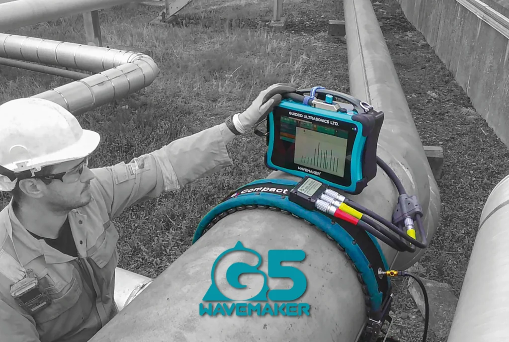 Technician using a GUL Wavemaker G5 Guided Wave Testing (GWT) system for industrial pipeline inspection and asset integrity assessment.