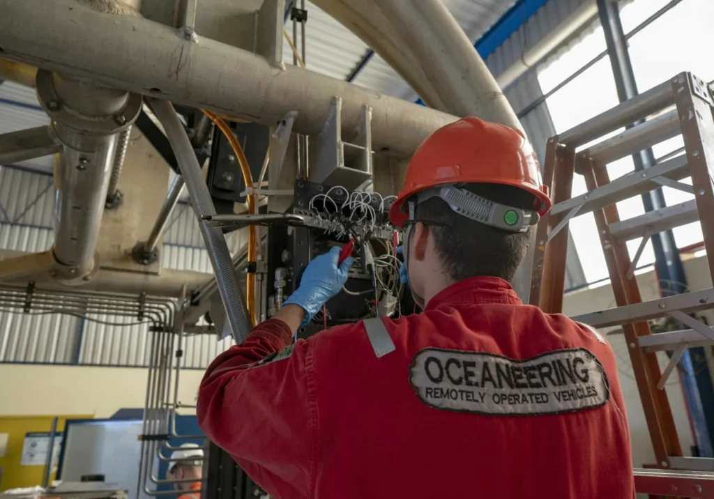 Oceaneering performs maintenance work on an industrial system as part of its subsea engineering and ROV contract operations services.